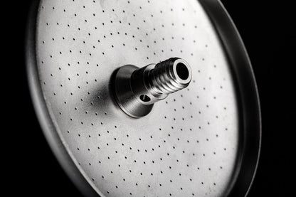 Laser-perforated face of an IMS Laser Brew shower screen with integrated screw