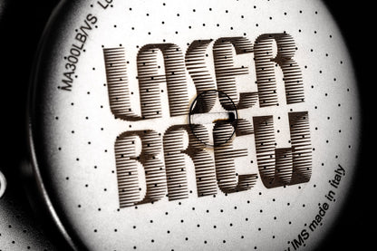 Close-up of the laser-perforated IMS Laser Brew shower screen, made in Italy
